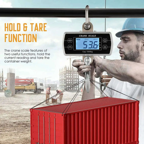 Digital Crane Scale 2200 Pound Capacity Heavy Duty Hanging Scale used for weighing a container in an industrial site.