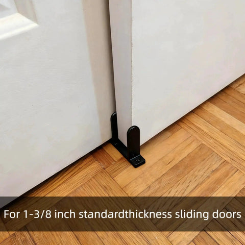 Universal Black Sliding Door Bottom Guides Set installed on 1-3/8 inch sliding doors on wooden floor