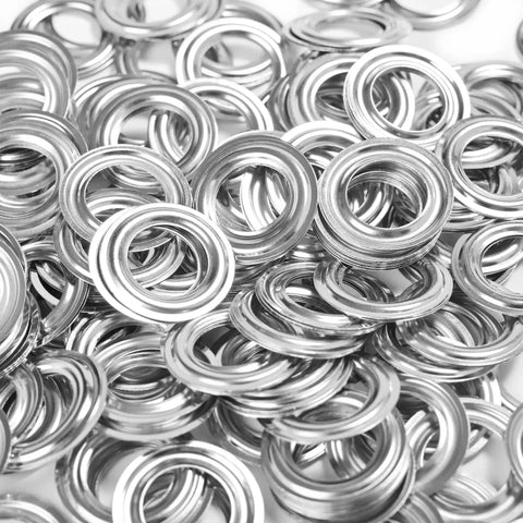 Close-up of iron grommets and washers from Grommets Kit 1000 Pcs 3/8 Inch Washers and Eyelets for Banners and Posters