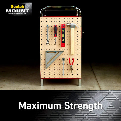 Double-sided heavy-duty mounting strips and tape for walls and outdoor use, displaying tools on a wooden pegboard.