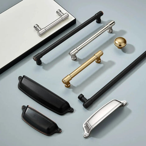 Various kitchen cabinet hardware including 10 Pack 3 Inch Antique Brass Cup Pulls With Aged Gold Finish for cabinets and drawers.