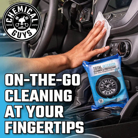 Total Interior Cleaner And Protectant Wipes Mega 50 Pack For Cars Trucks SUVs Motorcycles RVs And More Safe Easy Clean Up No Mess For All Surfaces By Chemical Guys in use inside car with hand grabbing a wipe.