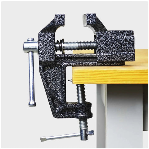 2 In 1 Mini Bench Vise And Hook Sharpener For Diyers, Portable Jeweler Table Clamp attached to a wooden workbench