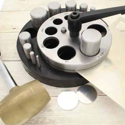 Pro Grade Heavy Duty Steel Circle Disc Cutter Set with ten punches and die cuts, rubber base, and handle, shown with metal discs