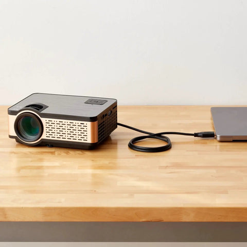 DisplayPort To HDMI Cable 6ft Unidirectional 4K 30Hz Gold Plated connecting a laptop to a projector on a wooden table