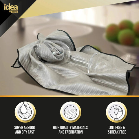 Premium Microfiber Cleaning Cloth 16x24 Ultra Absorbent Streak Free Pack of 2 wrapping a glass on a countertop
