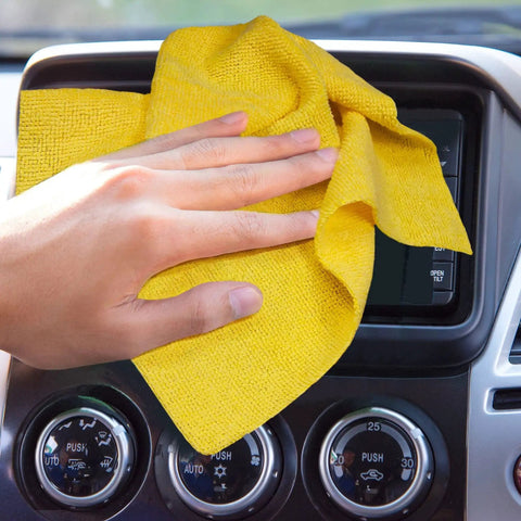 Hand using Edgeless 200 GSM Microfiber Cleaning Cloths 12x12in on car dashboard screen for a scratch-free clean.