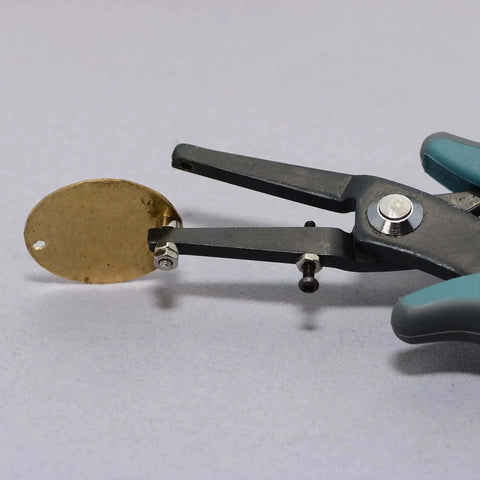 1.8mm Metal Hole Punch With Gauge Guard for clean indent-free holes in brass sheet, shown making a hole for 1.3mm rivets and cold connections.