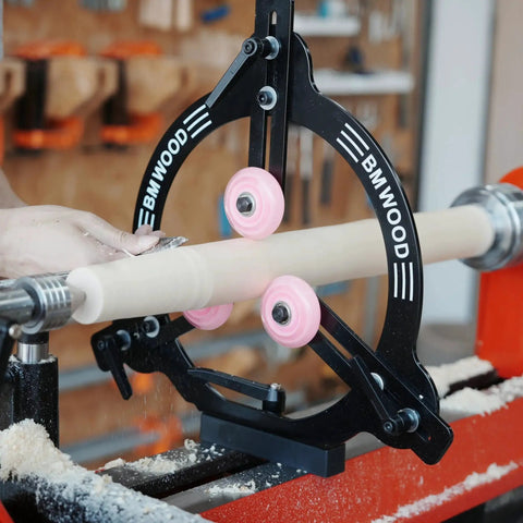 Pro Grade Woodturning Steady Rest For 12 Inch 14 Inch And 16 Inch Swing Lathes Ideal For Spindle Turning Heavy Duty Steel Plate Three Rubber Coated Rollers For Smooth Mobility And Stability Dual Bearing Design attached to a lathe.
