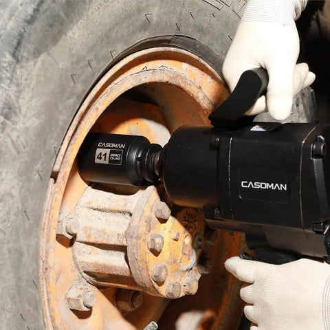 Three Quarter Inch Drive Deep Impact Socket 41 Millimeter Jumbo Metric Six Point Chrome Molybdenum Steel Black Phosphate Finish Built For Heavy Duty Impact Tools And Tough Fasteners shown in use on a large vehicle wheel