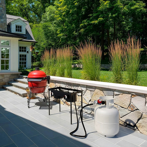 NUPICK propane regulator with 6ft hose and gauge for LP gas, connected to white propane tank beside outdoor smoker and grill