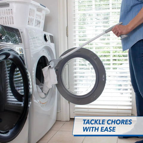 Person using 32 Inch Grabber Plus Reacher Tool With Built In Magnet For Trash Pickup And Yard Cleanup to reach laundry from washer