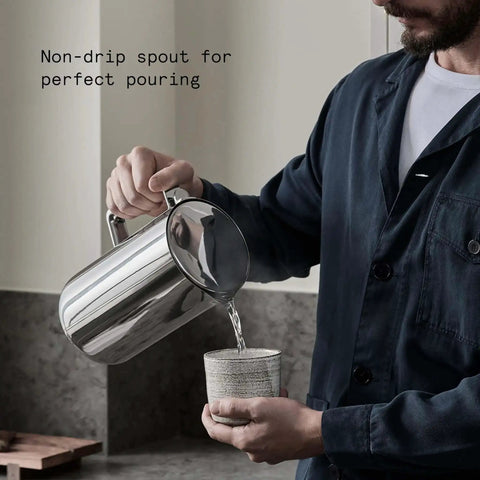 Person using Stainless Steel Electric Kettle With Precision Temperature Control From 104 To 212 F 1200 Milliliters Capacity Double Wall Design