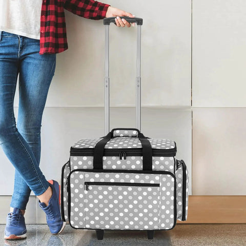 Person with Detachable Dolly Sewing Machine Case With Rolling Tote and Removable Bottom Pad for Standard Sewing Machines, Gray Dots Design.