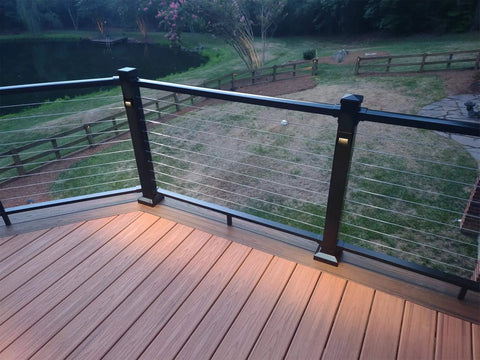 Six Pack Slim Square Low Voltage Deck Post Lights For Posts And Steps installed on wooden deck railing