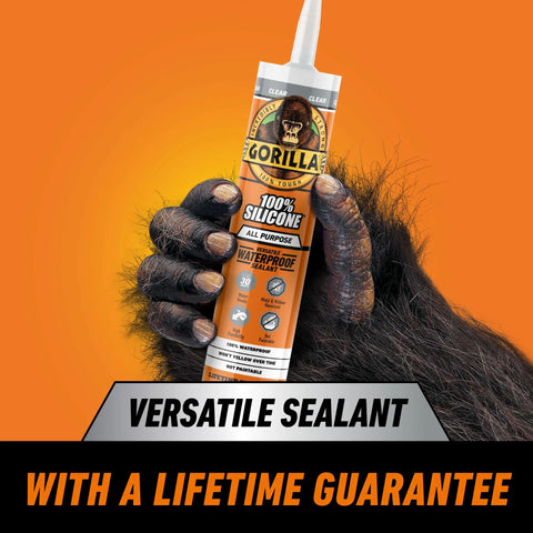 Gorilla 100% silicone sealant cartridge, all-purpose, clear, 10 oz, held by a gloved hand