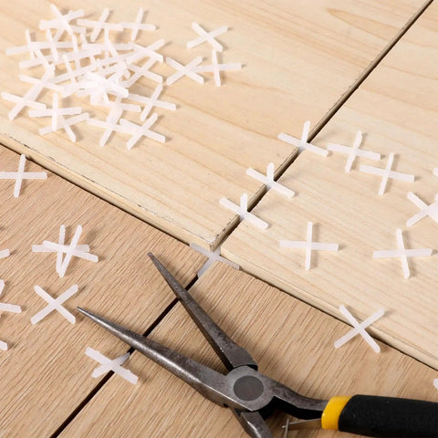 One Sixteenth Inch Tile Spacers Set, 500 Pcs Cross Tile Leveling Clips, Durable PE Plastic Shim Spacers on wood tiles