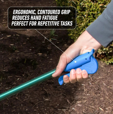 Close-up of 36 Inch Nifty Nabber Reacher Grabber Tool with ergonomic grip in use for yard cleanup, showing hand holding tool.