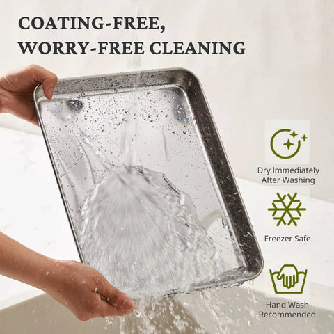 Person rinsing a stainless steel baking pan from the Stainless Steel Baking Sheet Set With Wire Racks Includes 3 Pans And 3 Racks In 9 12 16 Inch Sizes Non Toxic PFOA PTFE Free Warp Resistant Durable Oven And Toaster Safe Navy Finish For Go To Everyday Baking, showing water hitting the surface.