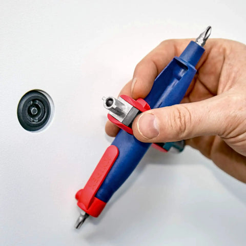 Hand holding a Pen Style Control Cabinet Key With Swivel Four Profile Heads, Eight And One Eighth Inch Long, used on a panel lock.