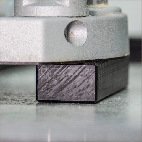 Close-up of Adjustable Router Jig Frame and Guide System for Cutting Square and Rectangular Recesses, Slots, and Face Panel Molds With a Router, Large 23.6 By 23.6 Inches Working Area, Four 27.6 Inch Extrusion Rails With Dual Metric Imperial Scales Varijig in use.