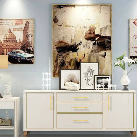 White sideboard with Brushed Brass Cabinet Pulls 3 Inch T Bar Drawer Handles For Kitchen Cupboard And Drawer Hardware Pack Of 10 Durable Stainless Steel Construction With Easy Mount Holes Smooth Gliding Operation And Timeless Brass Finish, adorned with modern decor and art.