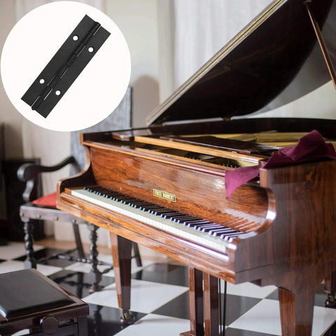 Six Pack Continuous And Piano Hinges For 4 Inch Openings In Black 304 Stainless Steel, shown near a grand piano.