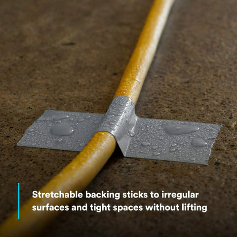 Multi-Use Silver Duct Tape 1.88 in x 60 yd x 7 mil used on a wet yellow hose for repair.