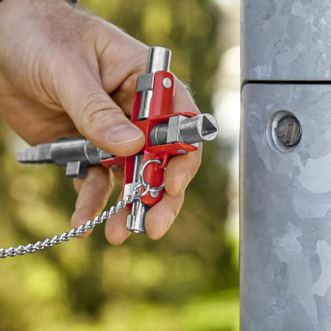 Hand holding Universal Construction Control Cabinet Key with Plug In Magnetic Support for Profile Cylinder Locks