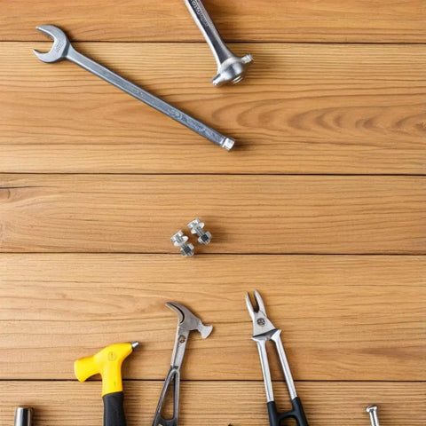 Pair M Two Point Five By Zero Point Four Five By Seven Pro Grade Miniature Screws on wooden surface with tools
