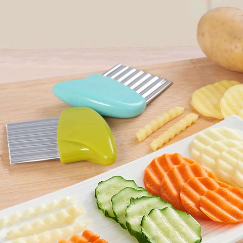 Two Pack Crinkle Cutter Set For Veggies And Chips Stainless Steel Wavy Cutter For Potatoes Carrots Lettuce Butter And More Green And Blue Handles Kid Friendly Kitchen Tool For Safe Fun Cooking No Mess Prep And Quick Easy Meal Prep on wooden board with sliced vegetables