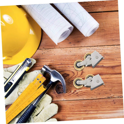 Two Pack Sliding Door Rollers For Cabinet And Pocket Doors Sleek Track Pulley Hardware Easy Install Replacement Wheels Quiet Durable Closet Door Rollers For Modern Home And Office Renovations shown on a wooden surface surrounded by tools and blueprints.