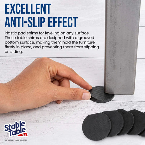 Hand using Black Rubber Table Leveler Wedges Set For Restaurant Tables And Home Furniture Three And Three Quarter Inch Anti Slip Non Slip Stackable DIY Levelers For Wobbly Tables Doors And More Pro Grade Grip under table leg