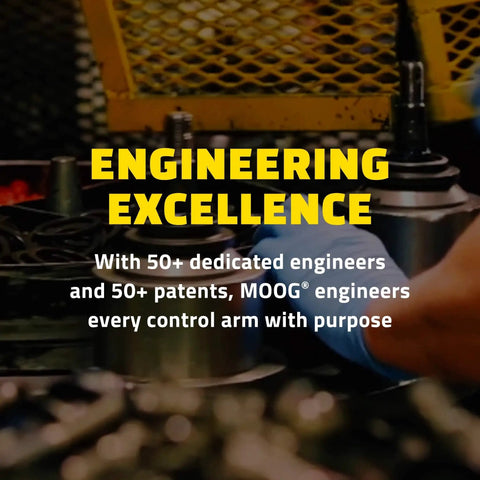 Engineering Excellence sign with machinery and gloved hand in workshop setting.