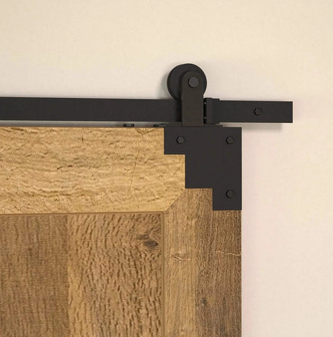 Rustic Forged Iron Corner Bracket For Barn Door In Matte Black Finish 75 mm installed on wood door corner with mounting hardware