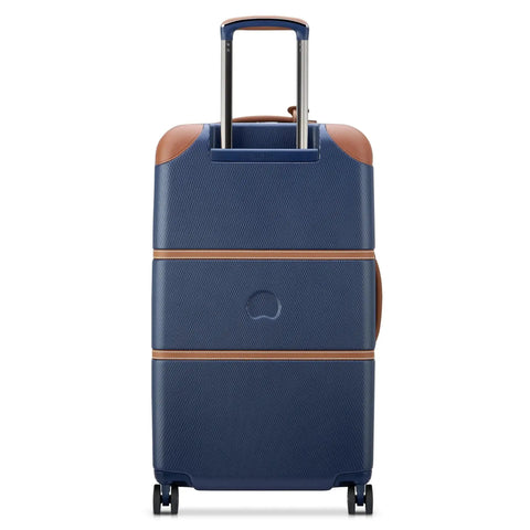 Rear view of Chatelet Air 2.0 Hardside Luggage Trunk With Spinner Wheels Navy Blue 26 Inch Durable Polycarbonate Shell Featuring Basketweave Textured Build Faux Leather Accents And Corner Protectors Lightweight Travel Case By Delsey Paris