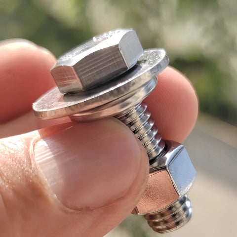 Close-up of 3/8-16 X 1-1/4 stainless steel hex head screw, nut, and washer from 8 Sets Kit by Bolt Fullerkreg for heavy-duty projects