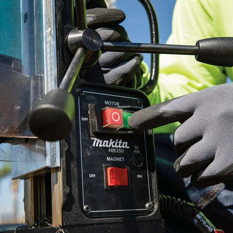 Close-up of Portable Magnetic Drill For Steel With One And Three Eighths Inch Capacity And Two Inch Thick Cutting, operator pressing button