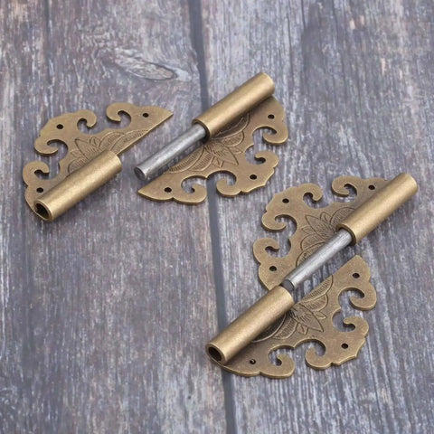 Two Piece Brass Flower Cloud Hinge Set For Jewelry Boxes And Furniture Decor With Screws 60 By 55mm on wooden surface