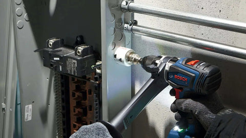 Two And A Quarter Inch Bi Metal T Slot Hole Saw With Eight Percent Cobalt M42 Alloy For Pro Grade High Temperature Tougher And Cleaner Cuts In Metal Wood And Plastic Featuring Triangle Chip Clearance For Quick Plug Removal Bosch HBT225 in power drill in use