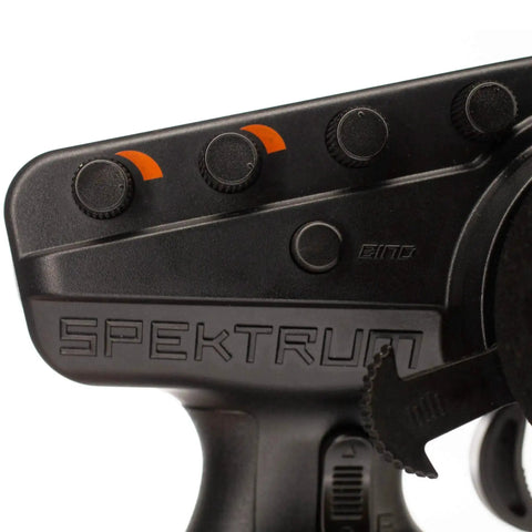 Close-up of DX3 Smart Three Channel Transmitter controls for RC cars and trucks, featuring foam wheel and DSMR tech.
