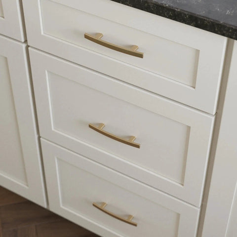 Champagne Bronze Cabinet Handles 3 Inch Center To Center Classic Pulls installed on white kitchen cabinets showing elegant design