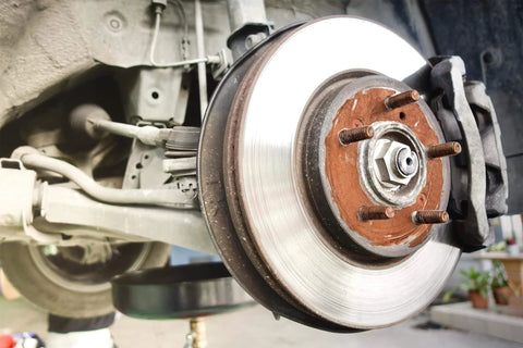Close-up of wheel hub on vehicle with Copper Based Anti Seize Lubricant 11 Oz For High Temperature Fasteners Up To 1202 F.
