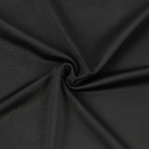 Close-up of black 250G spandex polyester fabric for Travel Luggage Cover for 18 to 22 Inch Suitcases with bold sublimation print.