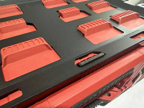 Close-up of Milwaukee Packout Wall Mounting Plate Dope Metal Base for Toolboxes on black and red storage unit