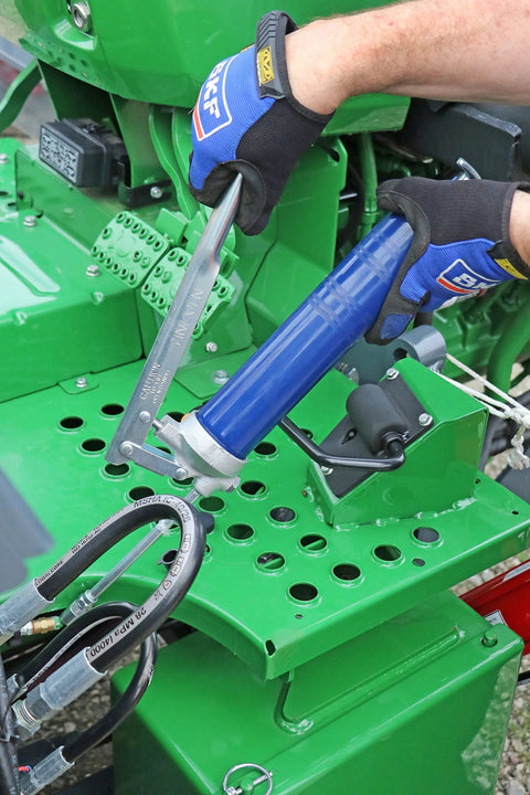 Lincoln 1142 lever-action grease gun with blue barrel and HD cast-iron pump head, in use with hydraulic coupler
