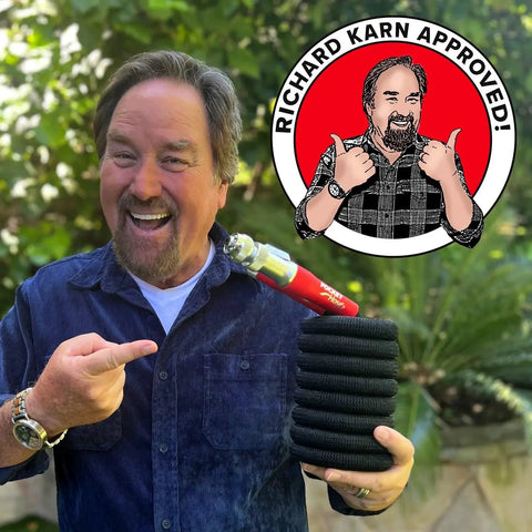 Man holding Expandable 50 Ft Garden Hose With Turbo Shot Nozzle For Quick Water Flow from Pocket Hose Silver Bullet Two Point Zero