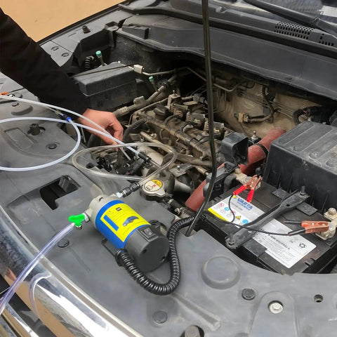 12V 100W Electric Engine Oil Transfer Pump For Oil Change With 3 Hoses in use on car engine