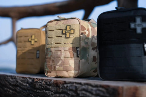 Tactical IFAK Trauma Kit With CAT Tourniquet for Wound Care in Durable MOLLE Pouch, Black Rhino Rescue Gear on display outdoors