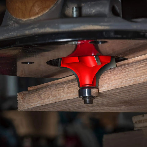Freud Quadra Cut One Half Inch Radius Rounding Over Router Bit For Pro Woodworking With Four Flutes installed in a router